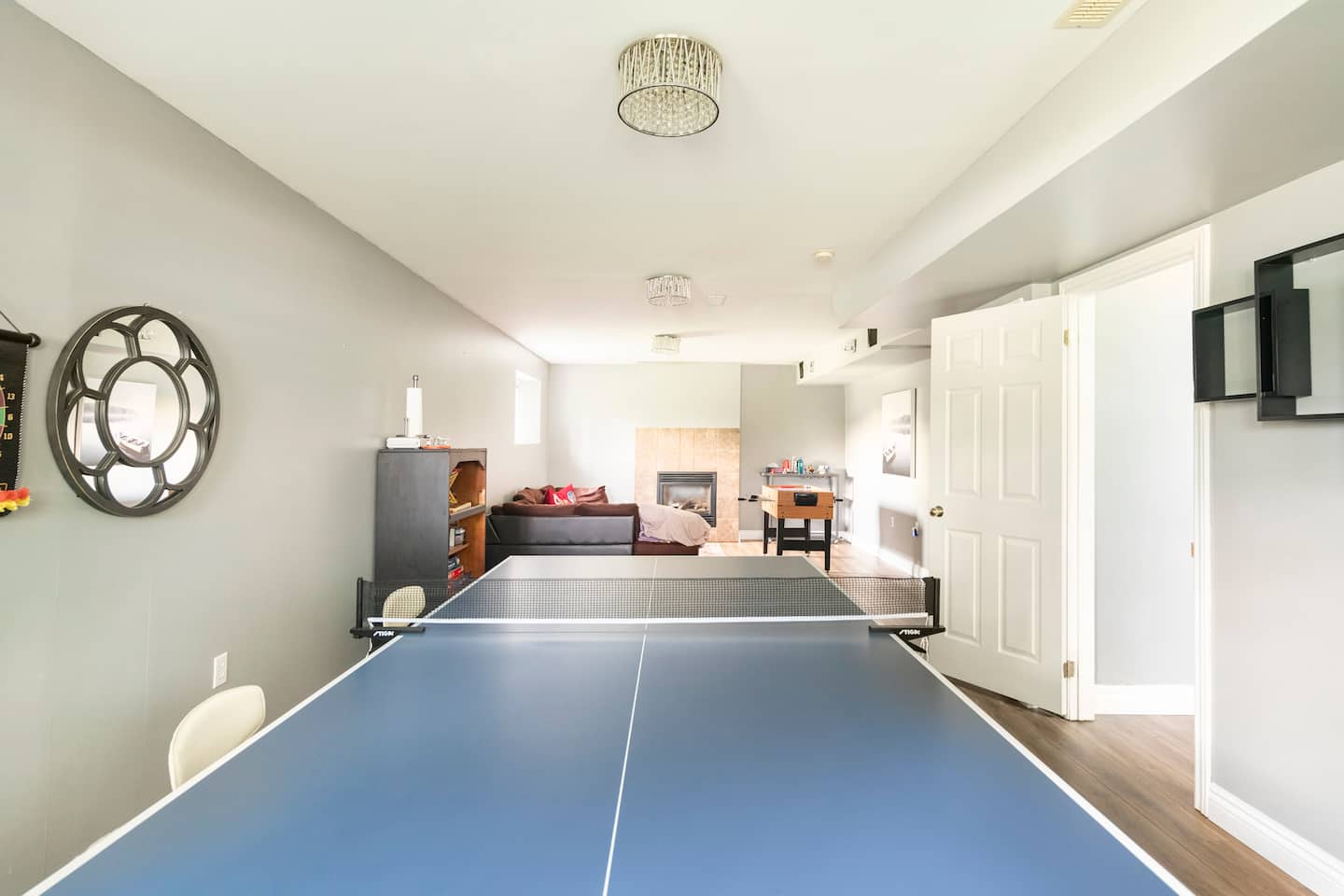 Basement game room with a ping-pong table